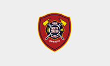 Shield-shaped fire department logo with crossed axes and a firefighter's helmet on a red background.