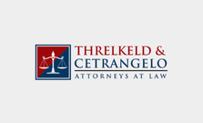 Logo for Threlkeld & Cetrangelo Attorneys at Law featuring scales of justice icon in red and blue.